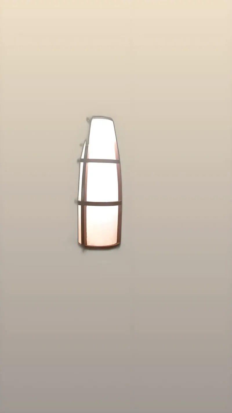 Lámpara encendida en ambiente oscuro: la luz cálida se filtra por el difusor de pergamino con silueta de reloj de arena